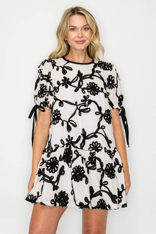 Ivory with Black Rosette Detail Mini Dress